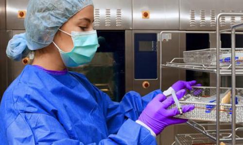 Sterile Processing Technician Cleaning Medical Instruments 